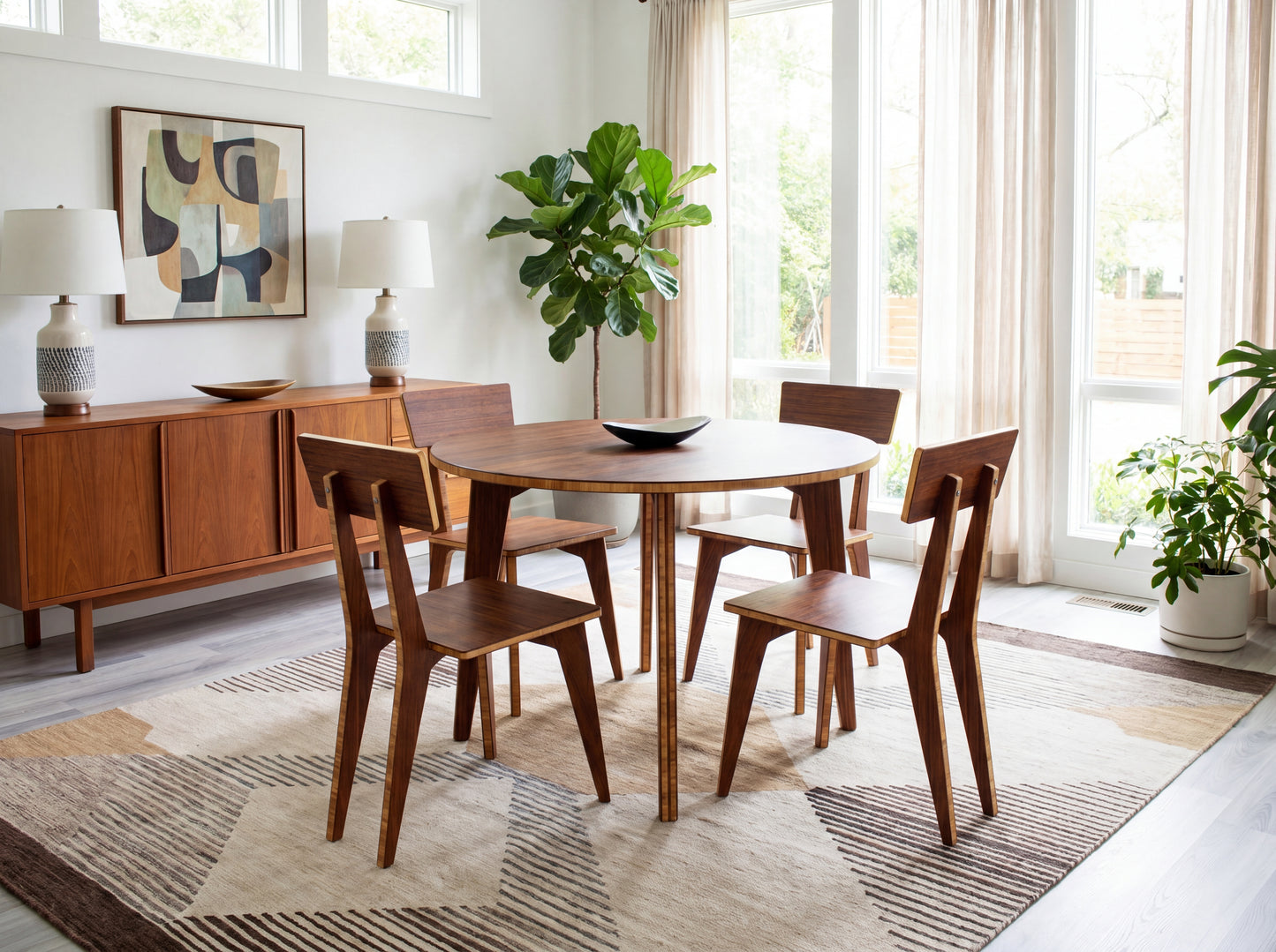 Dining room with bamboo table and chairs, sideboard, and large windows.