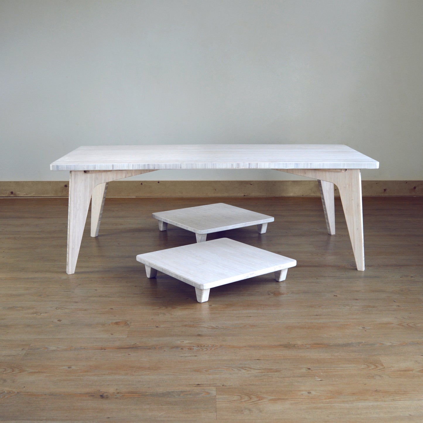 Natural bamboo pillow lift in white with table. Japanese, mid-century, Scandinavian and contemporary inspired. Sustainable wood alternative, made from solid grass.