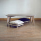 Grey bamboo table with pillow lifts. Japanese, mid-century, Scandinavian and contemporary inspired. Sustainable wood alternative, made from solid grass.