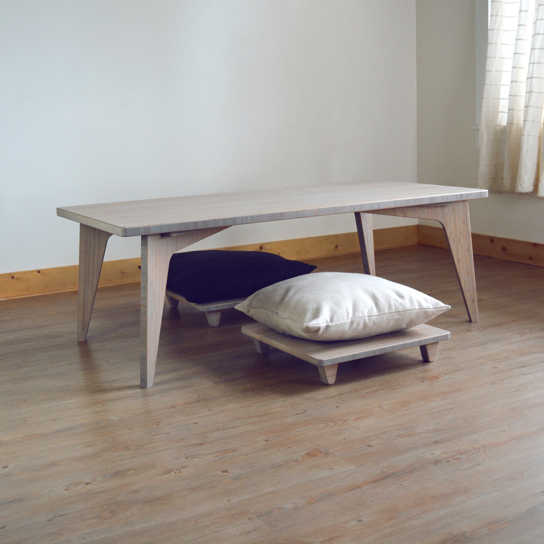 Sustainable grey bamboo table with two pillow lifts. Japanese, mid-century, Scandinavian and contemporary inspired.