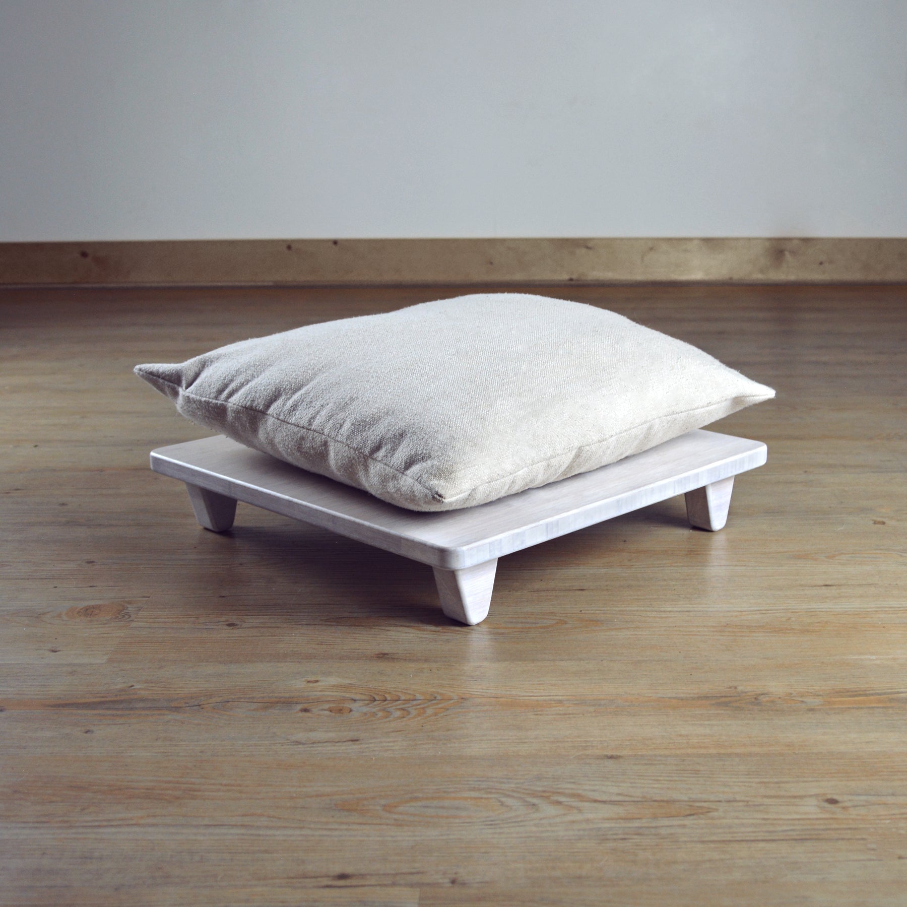 Natural bamboo pillow lift in white. Japanese, mid-century, Scandinavian and contemporary inspired. Sustainable wood alternative, made from solid grass.